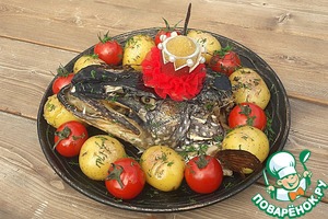 Щучья голова с чесноком в духовке
